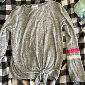 Long sleeve top with bow at the bottom